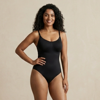 Woman in the black Shapify snatched bodysuit, full-length front view